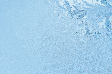 Winter background, frost on window. Patterns made by frost on glass