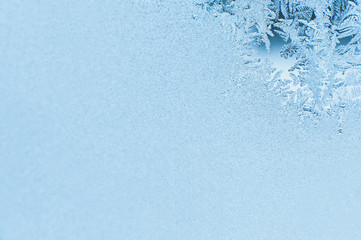 Winter background, frost on window. Patterns made by frost on glass