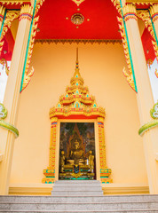 buddha statue  view through the door of temple