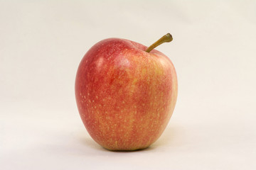 Red apple on a white background closeup