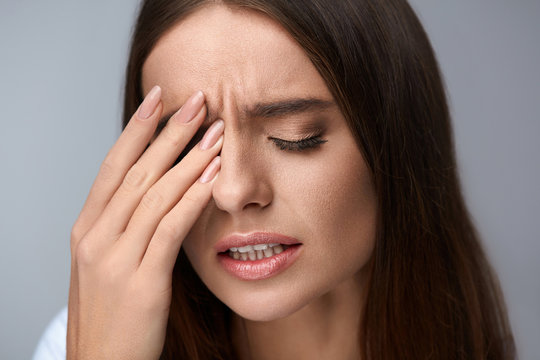 Woman Suffering From Strong Pain, Having Headache, Touching Face