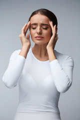 Fototapeta premium Headache. Beautiful Woman Feeling Stress And Strong Head Pain