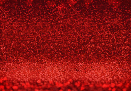 Abstract vivid red sparkling glitter backdrop in perspective ang