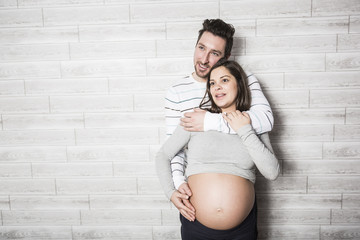 Pregnant Mother and her husband on baby room