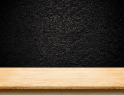 Wood table top with blur black stone wall,Mock up template for d