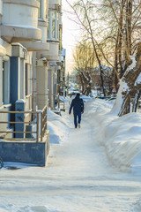 People walking along a snowy street