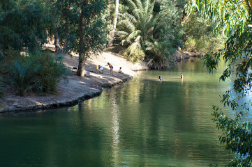 Naklejka premium Baptism at Tiberias, Jordan River, Israel.