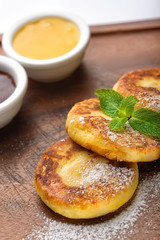 Fritters on a wooden stand.