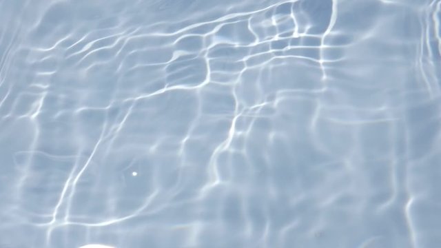 Light reflection on transparent pool surface slow-mo 1920X1080 HD footage - Waving liquid in blue container producing nice visual effect in slow motion 1080p HD video