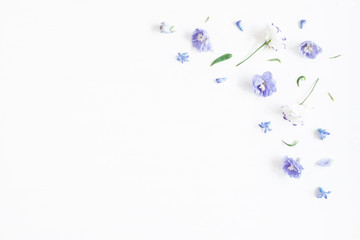 Flowers composition. Border made of lilac and white flowers. Flat lay, top view