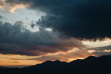 Sunset Behind Mountain in the rainy season