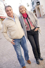 Fototapeta premium Senior couple enjoying journey in town