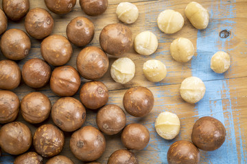 macadamia nuts on rustic wood