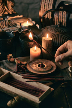 Crop shot of a hand with aromatic candles