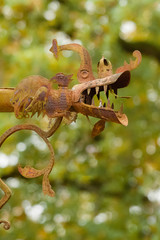 Vintage style handmaded rusted metal royal dragon on green crown