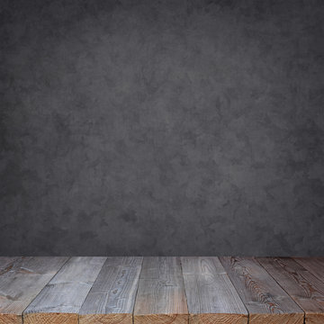 Empty Wooden Table Against A Grey Wall.