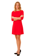 Portrait of beautiful brunette young woman in red dress isolated
