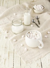 white cup with cocoa and marshmallows, selective focus