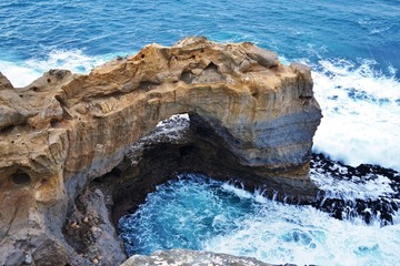 The Arch rock formation in Port Campbell National Park off the Great Ocean Road in Victoria,...