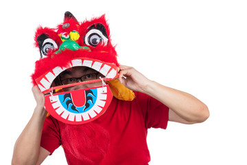 Asian Chinese man perform lion dance celebrating Chinese New Yea