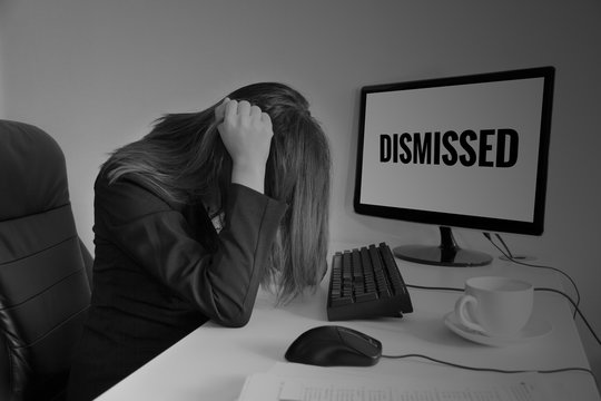 Stressed or headache business woman at office desk, dismissed