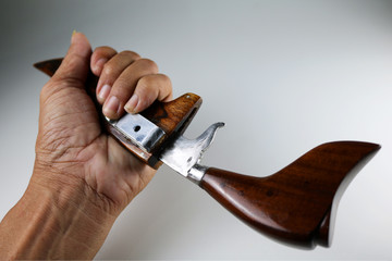 Thai pocket knives with white background.