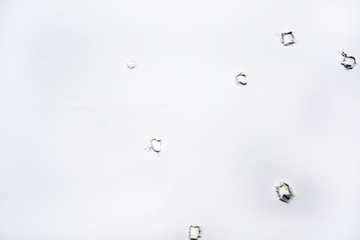 Gun holes on paper.
