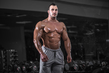 Fototapeta na wymiar Muscular man in gym.