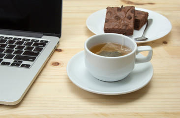 closeup hot tea cup on wooden background