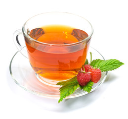 Cup of tea with raspberry isolated