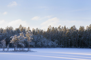 Winter wonderland. Small island. Sunrise in Finland.