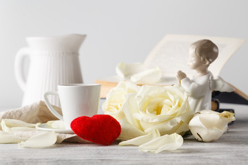 Valentine's setting with bouquet of white roses and coffee. Sele