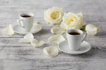 Obraz na płótnie Canvas cup of coffee and a rose breakfast