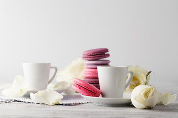 Sweet and beautiful French macaroon in a glass jar and espresso