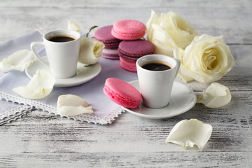 Sweet and beautiful French macaroon in a glass jar and espresso