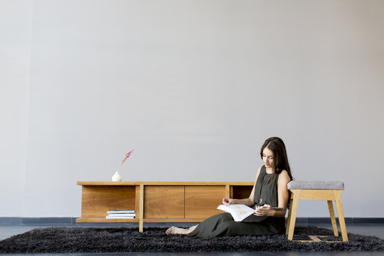 Pretty Young Woman Reading A Book