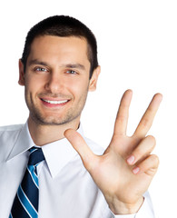 Portrait of happy smiling businessman showing three fingers, isolated on white background. Success in business, job and education concept studio shot.