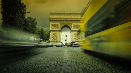 Triumphal Arch in Paris with traffic cars from Champs Elysees