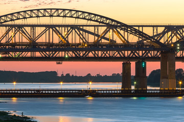 Spring evening in Nizhny Novgorod. Borsky bridge through Volga in the light of a decline