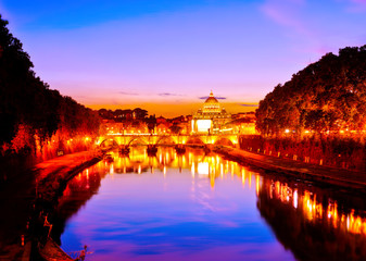 View of St. Peter's Basilica and Aelian Bridge at dusk in Rome 