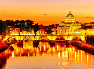 Fototapeta premium View of St. Peter's Basilica and Aelian Bridge at dusk in Rome 
