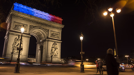Fototapeta premium Triumphal Arch in Paris illuminated for Christmas in night