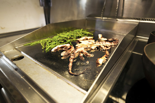 Preparing fresh calamari and beans