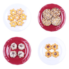 A lot of Cookies on the plates isolated on the white background
