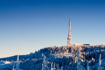 Radio tower in winter scenery