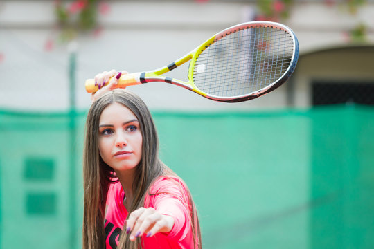 Young woman playing tennis,waiting the ball