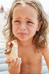 Little boy eating an ice cream