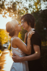 Fototapeta premium guy and the girl embracing on a background of park