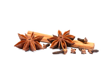 Aromatic star anise, cloves and cinnamon isolated on white background