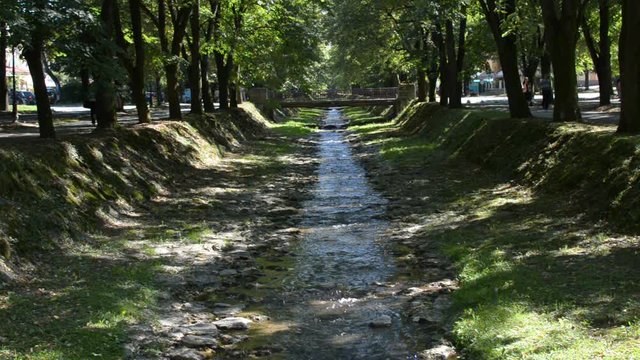 Small river flows under a bridge in the city of Vrnjacka Banja in Serbia 